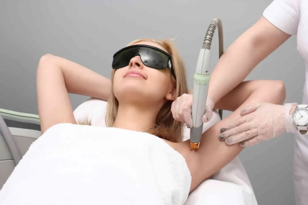 A dermatologist performing laser hair reduction treatment at SkinMD Clinic, Pune — using advanced laser technology for safe, long-lasting hair reduction.